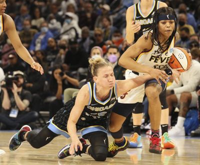 Chicago Sky guard Courtney Vandersloot (22) battles with Indiana Fever guard Destanni Henderson (33) after losing the ball on May 24, 2022, at Wintrust Arena.  (Tribune News Service)