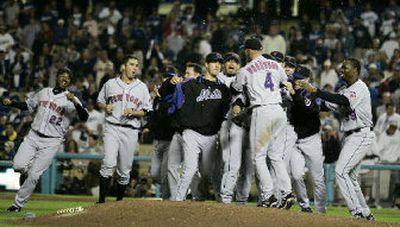 The New York Mets gather on the field after dispatching the Dodgers in the N.L. divisional series.
(Associated Press / The Spokesman-Review)