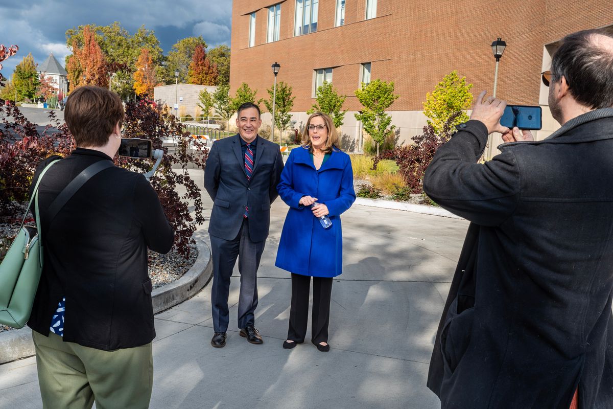 Before the Northwest Passages Eastern Washington Debates, incumbent Democrat Steve Hobbs and nonpartisan Pierce County Auditor Julie Anderson have their photos taken outside of Gonzaga University’s Myrtle Woldson Performing Arts Center, Sunday, Oct. 23, 2022. The event was sponsored by the the Spokesman-Review, League of Women Voters, KSPS-TV and the Washington Debate Coalition.  (Colin Mulvany/The Spokesman-Review)