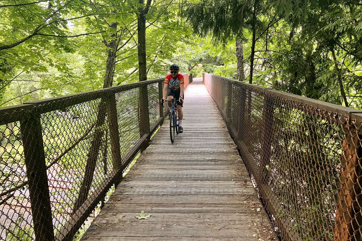 A “secret” wooden bridge crosses over rail lines on the bike route from Elliott Bay to Ballard. (John Nelson)