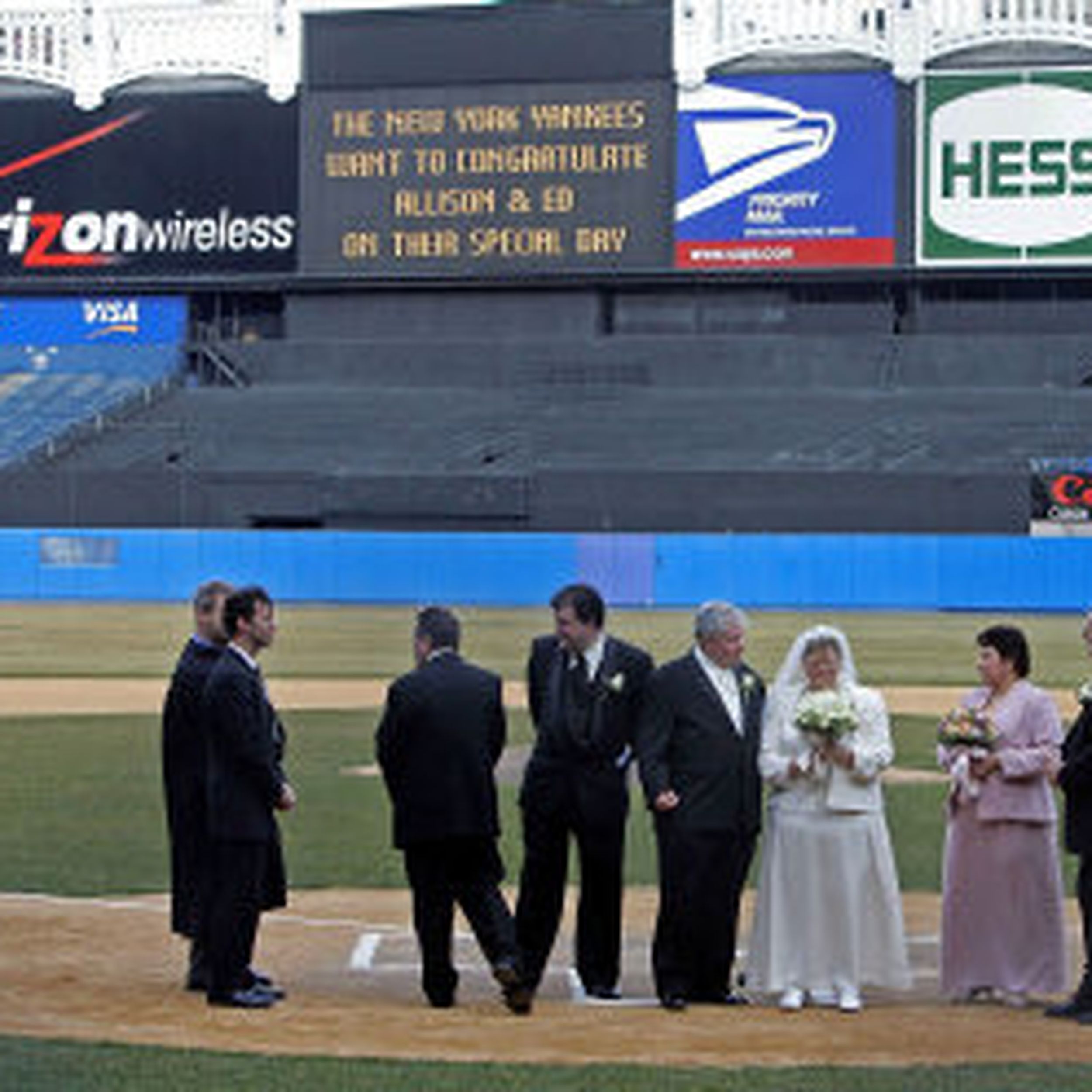 Joe DiMaggio, Yankee outfielder, kisses his bride, the former