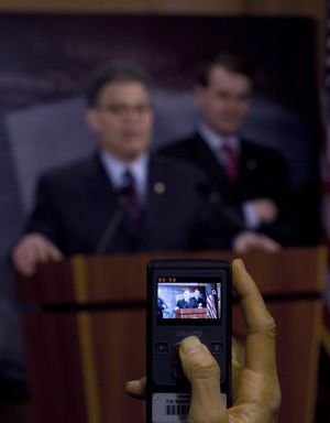 Sen. Al Franken, D-Minn., left, and Sen. Michael Bennet, D-Colo., are taped on Capitol Hill in Washington, Tuesday, April 27, 2010, during  a news conference to discuss Facebook's new information policy. (Harry Hamburg / Fr170004 Ap)