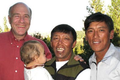 Chris Kopczynski was the Spokane host for Ang Dorjee Sherpa, right, and Lhakpa Dorjee Sherpa, holding the baby. (Rich Landers / The Spokesman-Review)