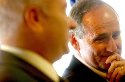 
Gov. Jim Risch listens to Senate President Pro-Tem Bob Geddes during a press conference about property tax relief at the governor's Coeur d'Alene office on Tuesday. 
 (Kathy Plonka / The Spokesman-Review)