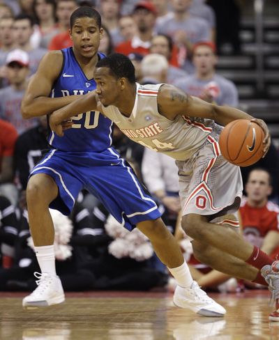 Ohio State’s William Buford, driving against Duke’s Andre Dawkins, scored 20 points for the Buckeyes. (Associated Press)