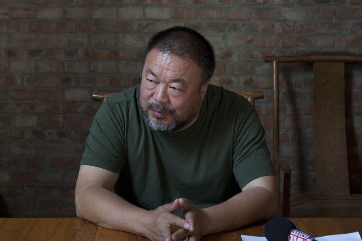 Chinese artist Ai Weiwei speaks to journalists at his studio in Beijing on May 22. (Associated Press)
