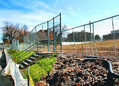 
A fence surrounds old tennis courts on the Washington State University campus. State lawmakers are proposing to spend $58 million on a life sciences building  on the site.  
 (Amanda Smith / The Spokesman-Review)
