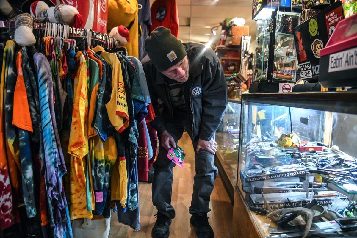 Scott Chumley searches high and low for toy Volkswagen vans at Ragpicker & Sons, a store in the Garland Business District, on Saturday, Nov. 30, 2019. Chumley said he owns thousands of VW toys, so it’s hard to find one he doesn’t already have. (Dan Pelle / The Spokesman-Review)