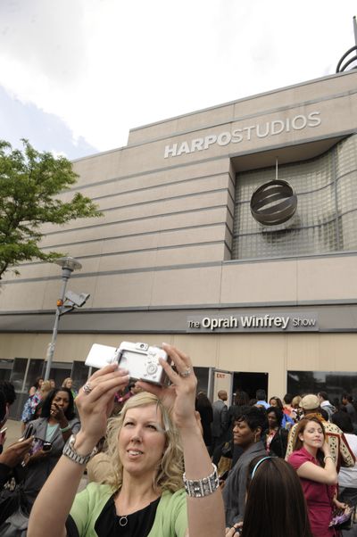 Members of the studio audience walk out of Harpo Studios after the final taping of “The Oprah Winfrey Show” in Chicago on Tuesday. The finale will air today. (Associated Press)