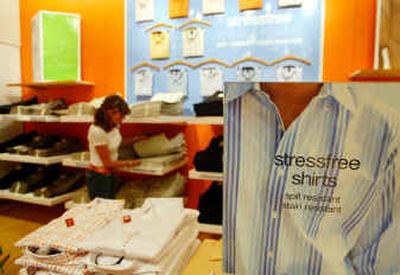 Jan Boltz, an assistant manager, sorts through stain resistant khakis behind a display of stressfree shirts and pants at a Gap store on Market Street in San Francisco.
(Associated Press / The Spokesman-Review)
