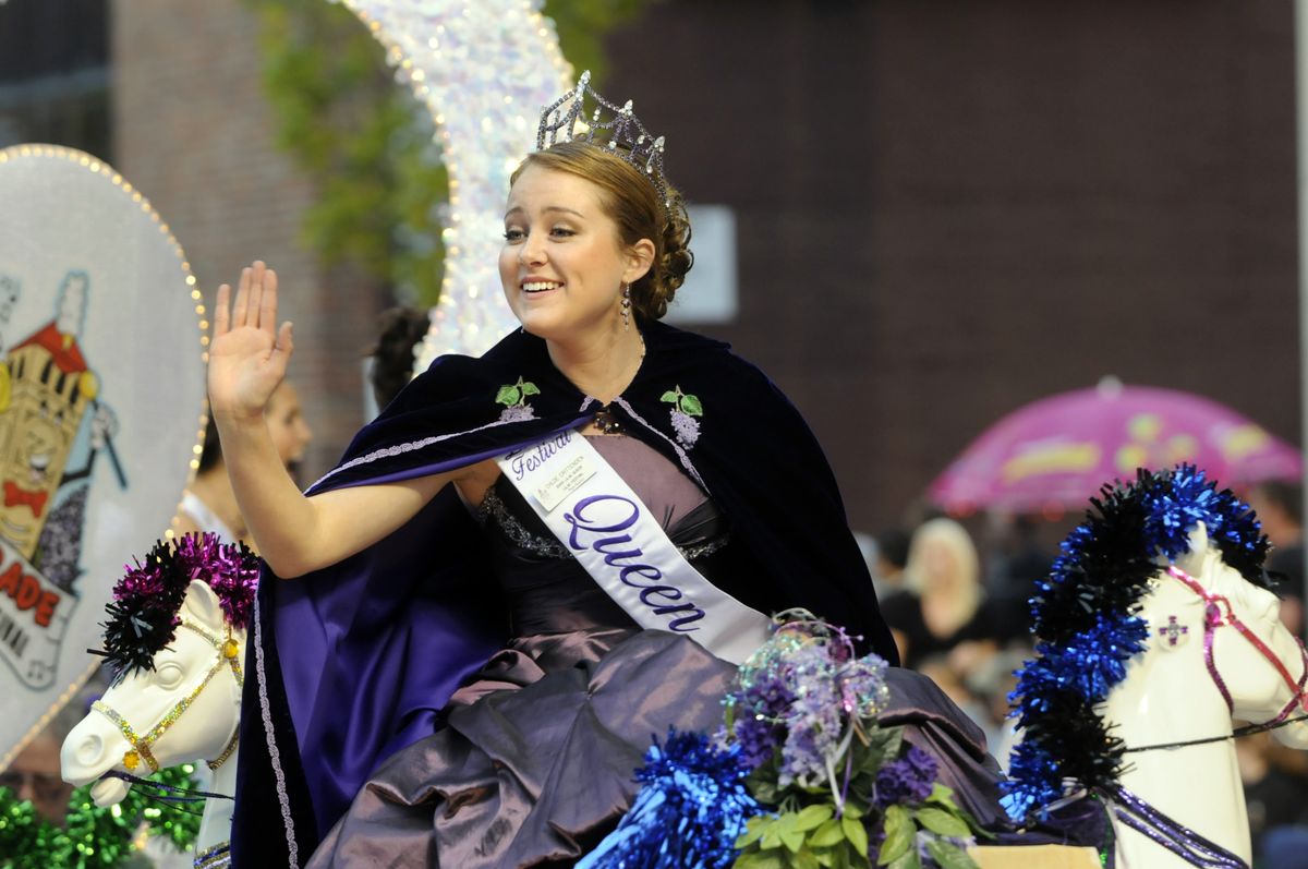 2009 Lilac Queen Chloe Crittenden waves to the crowd as she passes under the television lights during the 2009 Armed Forces Torchlight Parade Saturday in downtown Spokane.  (Photos by Jesse Tinsley / The Spokesman-Review)