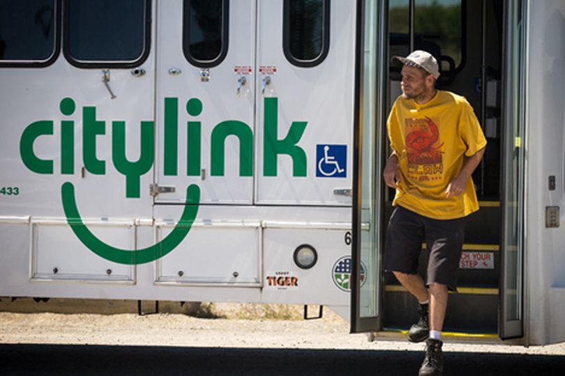 Martin Burke, of Coeur d'Alene steps off a Citylink bus Monday as it drops off passengers at the transit center in Riverstone. (Shawn Gust/press)