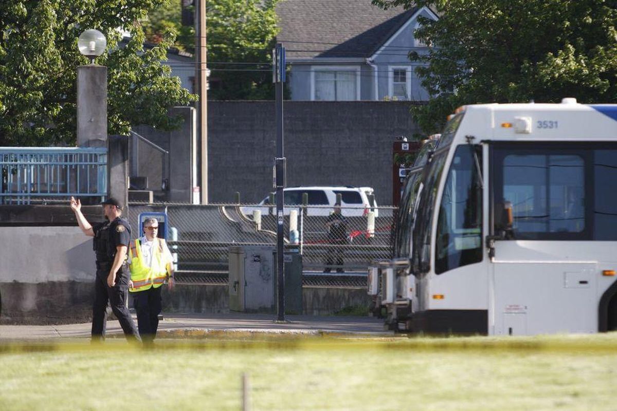 Police investigate a deadly stabbing on a Metropolitan Area Express train in northeast Portland, Ore., Friday, May 26, 2017. Police in Oregon say several people died and another was hurt in a stabbing on a Portland light-rail train after a man yelled racial slurs at two young Muslim women. (Jim Ryan / The Oregonian)