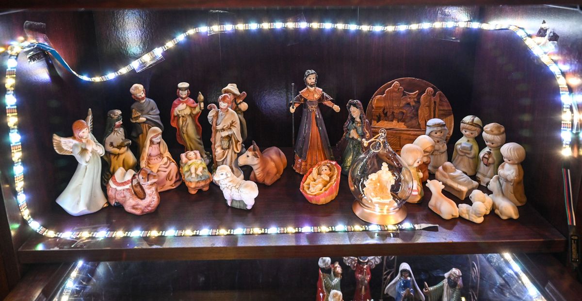 Joyce Hansen has a collection of 217 Nativity sets from around the world. These five are displayed in a glass-front cabinet.  (DAN PELLE/THE SPOKESMAN-REVIEW)
