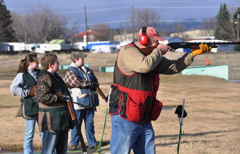 Roy Wickstrom, right, calls for a target at the Spokane Gun Club today, joined on the firing line by his family's three generations of trapshooters. Joining grandpa Roy from left are Taylor Hughes, Matthew Hughes and Kim Knapply. Also on the line but not pictured is Charles Knapply. The Newman Lake family was shooting at the club in Spokane Valley on the opening day of the 92nd annual Spokesman-Review Trapshoot, an eight-week event that involves dozens of clubs and teams in the Inland Northwest. (Rich Landers)