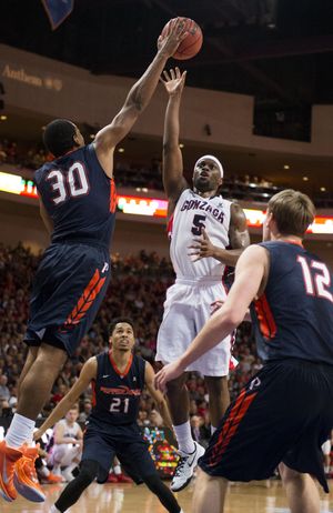 Gonzaga guard Gary Bell Jr. (5) shoots over Pepperdine guard Lamond Murray Jr. (30) in the first half of a WCC men's tournament semifinal basketball game, Mon., March 9, 2015, at the Orleans Arena in Las Vegas, Nevada. (The Spokesman-Review)
