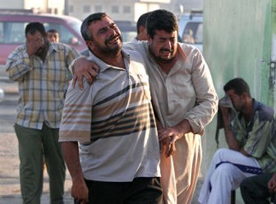 
Friends and relatives react before a funeral ceremony Thursday in the Sadr City district of Baghdad for religious pilgrims killed Wednesday in Baghdad. Thousands of people attended mass funerals in Najaf and Baghdad.
 (Associated Press / The Spokesman-Review)