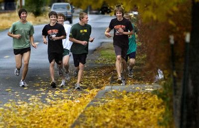 
Members of the West Valley High School cross country team run together after school Thursday. The team won its district title. 
 (Joe Barrentine / The Spokesman-Review)