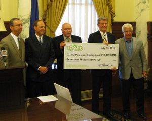 Gov. Butch Otter, second from right, joins other state officials to receive a giant mockup of a check for the $17 million Idaho's permanent building fund is getting from state lottery proceeds this year. (Betsy Russell)