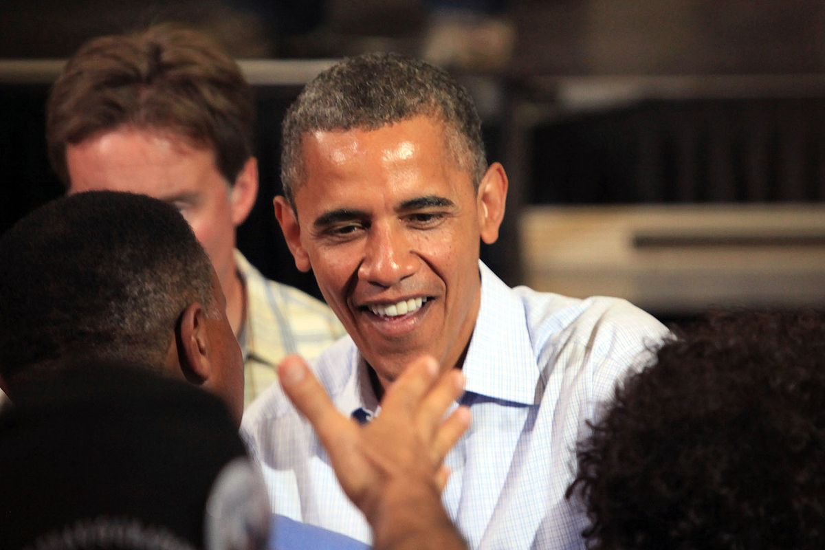 President Barack Obama greets people during a campaign stop at Florida Institute of Technology