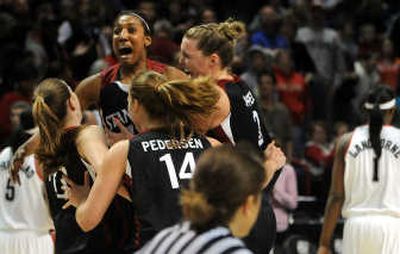 
Candice Wiggins, center, selected the outstanding player of the Spokane Regional, and her Stanford teammates celebrate in Arena. 
 (Rajah Bose / The Spokesman-Review)