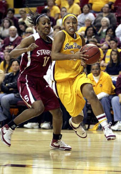 
ASU's Briann January, right, had a game-high 20 points on Sunday.
 (Associated Press / The Spokesman-Review)