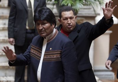 Venezuela’s President Hugo Chavez, back, and Bolivia’s President Evo Morales  meet in La Paz, Bolivia, on Friday.  (Associated Press / The Spokesman-Review)