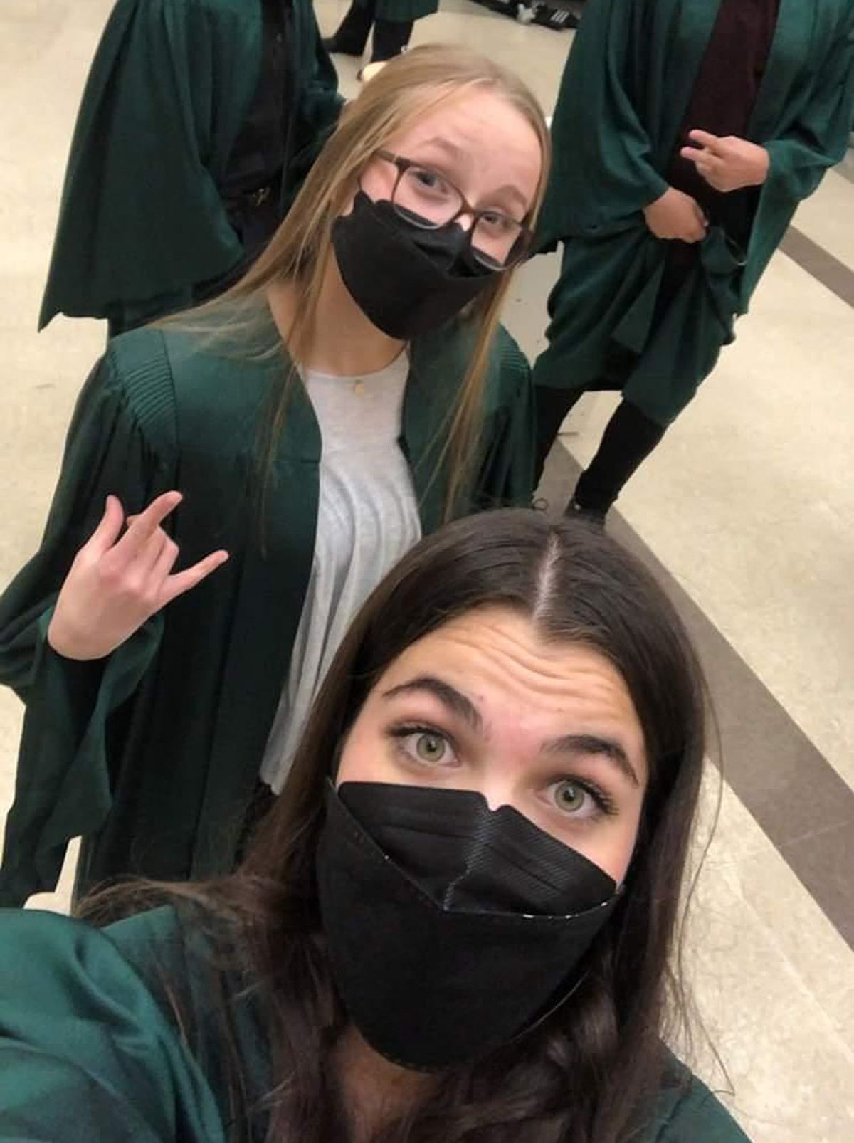 Shadle Park High School students Grace Schuck (front) and Chloe Sands (back) prepare for a choir concert in October 2021, their junior year.  (Courtesy of Grace Schuck)