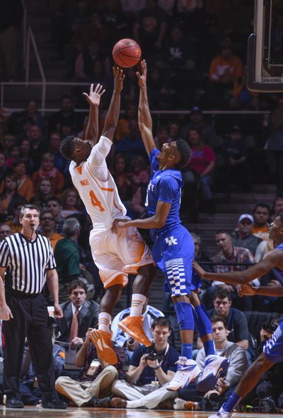Tennessee's Armani Moore shoots over Kentucky's Marcus Lee. (Associated Press)