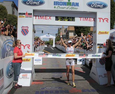 Julie Dibens celebrates the finish line of the 2011 Ford Ironman Coeur d'Alene Sunday afternoon in downtown Coeur d'Alene.  Bruce Twitchell/ Special to The Spokesman-Review