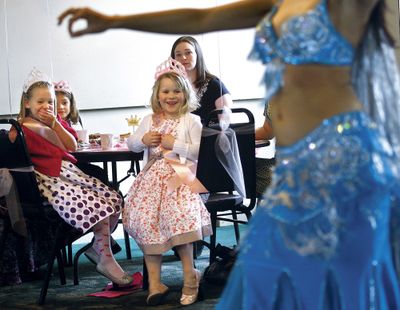 ORG XMIT: ORROS101 Taylor Hunt, 6, left, and Makena Cubic, 6, watch as Danijela Krstic, Miss Oregon 2008, performs a belly dance during a Princess Tea Party at the Umpqua Valley Arts Center in Roseburg, Ore., on Saturday, Feb. 21, 2009  Besides meeting Miss Oregon, the young girls at the event were taught proper tea party etiquette, the princess wave, and how to walk with confidence. (AP Photo/The News-Review, Robin Loznak) (Robin Loznak / The Spokesman-Review)