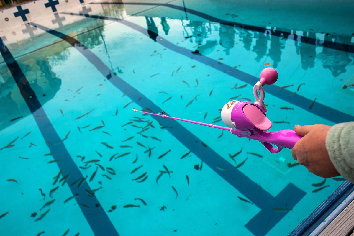 Willow Day, 8, uses her Rapunzel fishing rod during the innaugural Youth Fishing Frenzy! at Shadle Aquatic Center pool on Saturday, April 20, 2019. Spokane Parks and Rec stocked the pool with trout for children ages 5 to 14. (Kathy Plonka / The Spokesman-Review)