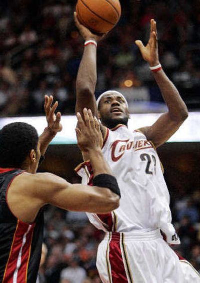 
LeBron James, right, torched the Heat for 47 points.
 (Associated Press / The Spokesman-Review)