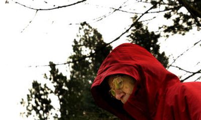 
Bernie Berglund braved the windy weather Monday to take her daily walk around her Coeur d'Alene neighborhood.
 (Kathy Plonka / The Spokesman-Review)