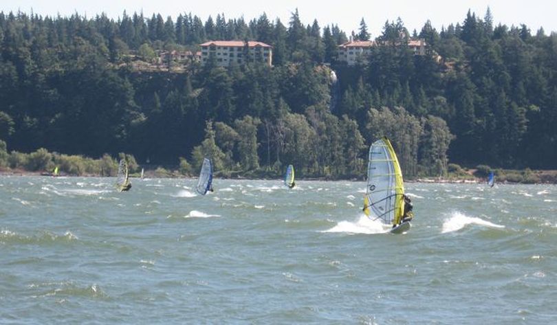 Windsurfers enjoy the Columbia River Gorge on Tuesday, including Betsy Russell, at right foreground with yellow sail. (Charles Russell)