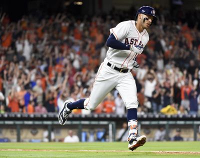 Houston Astros' Carlos Correa rounds the bases after hitting a solo home run off Seattle Mariners starting pitcher Felix Hernandez in the fourth inning of a baseball game, Monday, April 3, 2017, in Houston. (Eric Christian Smith / Associated Press)