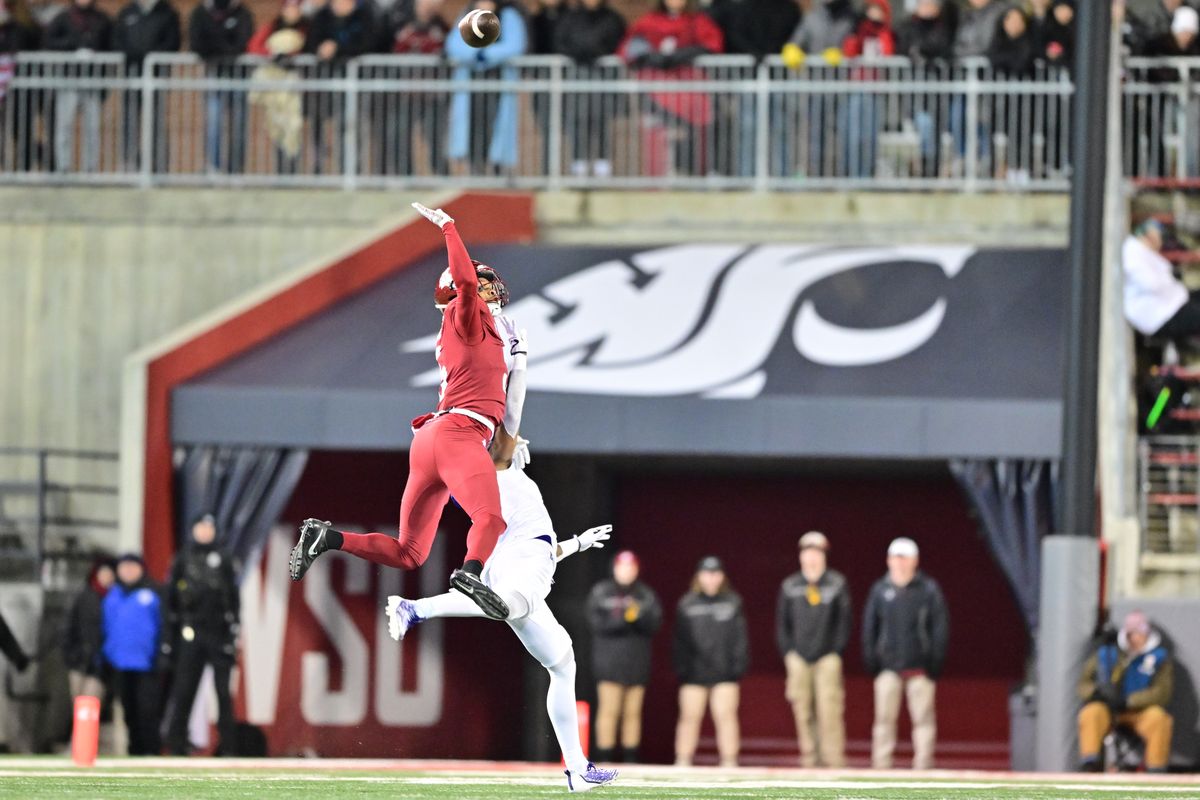 Washington State cornerback Derrick Langford Jr., left, jumps to defend a pass during the second half of a game against Washington on Nov. 26 at Gesa Field in Pullman. Langford signed an undrafted free agent deal with the New York Jets on Saturday.  (Tyler Tjomsland/The Spokesman-Review)