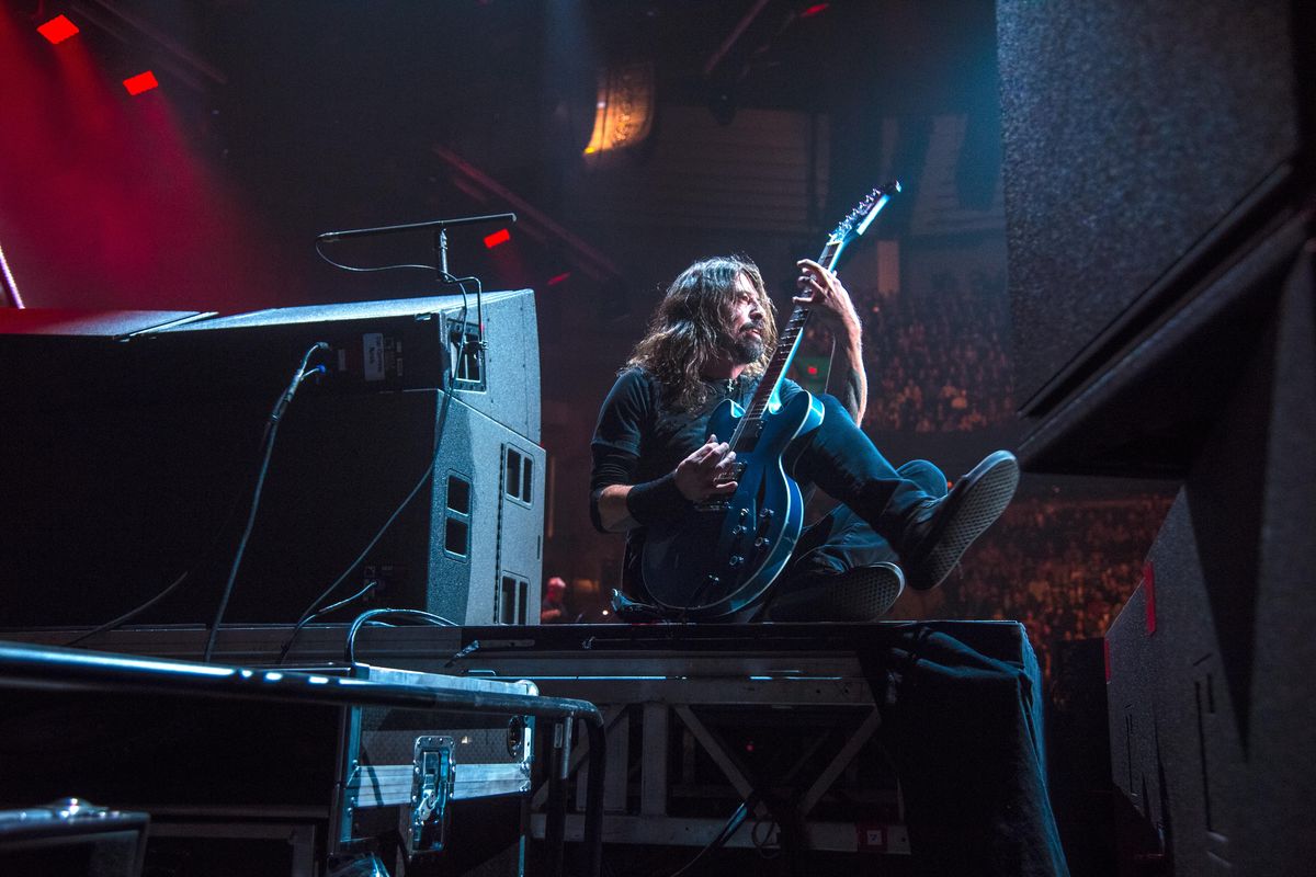 Foo Fighters’ front man Dave Grohl finds a spot along the edges of the stage during “All My Life,” Monday, Dec. 4, 2017, in the Spokane Arena. (Dan Pelle / The Spokesman-Review)