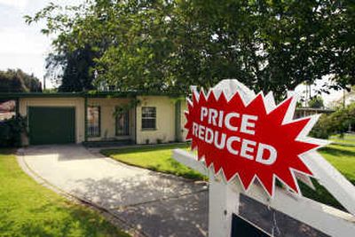 
A home is offered for sale in Riverside, Calif., on Monday. Wall Street suffered one of its worst losses of 2007 on Thursday, leading a global stock market plunge as investors succumbed to months of worry about the mortgage and corporate lending markets. Associated Press
 (Associated Press / The Spokesman-Review)