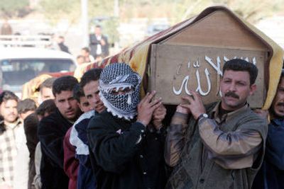 
 Relatives carry the coffin of Sheik Khadim Sarhid al-Hemaiyem during his funeral Wednesday in Baghdad. 
 (Associated Press / The Spokesman-Review)
