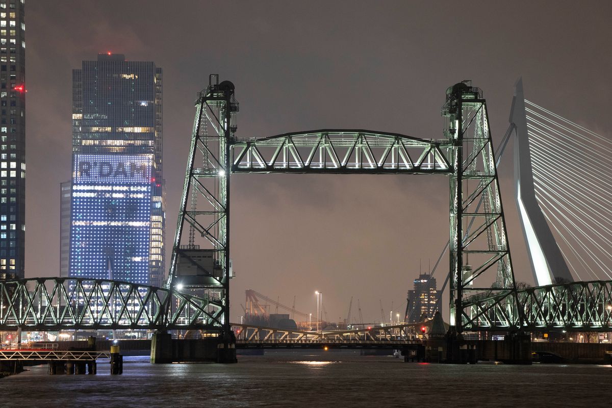 View of the Koningshaven Bridge, known as De Hef, (The Lift), in Rotterdam, Netherlands, Thursday, Feb. 3, 2022. A plan to dismantle the historic bridge in the heart of Dutch port city so that a huge yacht, reportedly being built for Amazon founder Jeff Bezos, can get to the North Sea is unlikely to be plain sailing. Reports this week that the city had already agreed to take apart the recently restored bridge sparked anger in the city, with one Facebook group set up calling for people to pelt the multimillion dollar yacht with rotten eggs. (Peter Dejong)