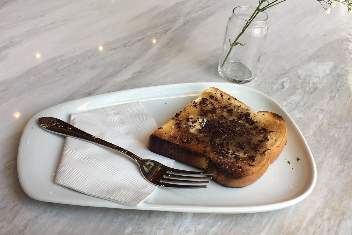 Fancy toast is on the menu at Indaba’s latest location, which opens Sept. 4 on West Riverside Avenue in downtown Spokane. Pictured here is the butterscotch toast with black salt and chocolate shavings. (Adriana Janovich / The Spokesman-Review)