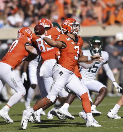 Oklahoma State quarterback Spencer Sanders (3) throws a pass during the first half of an NCAA college football game against Baylor in Stillwater, Okla., Saturday, Oct. 19, 2019. (Brody Schmidt / Associated Press)