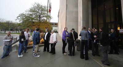 Couples applying for a marriage license wait outside the Polk County administrative building Monday in Des Moines, Iowa, after a state Supreme Court ruling legalizing gay marriage took effect.  (Associated Press / The Spokesman-Review)