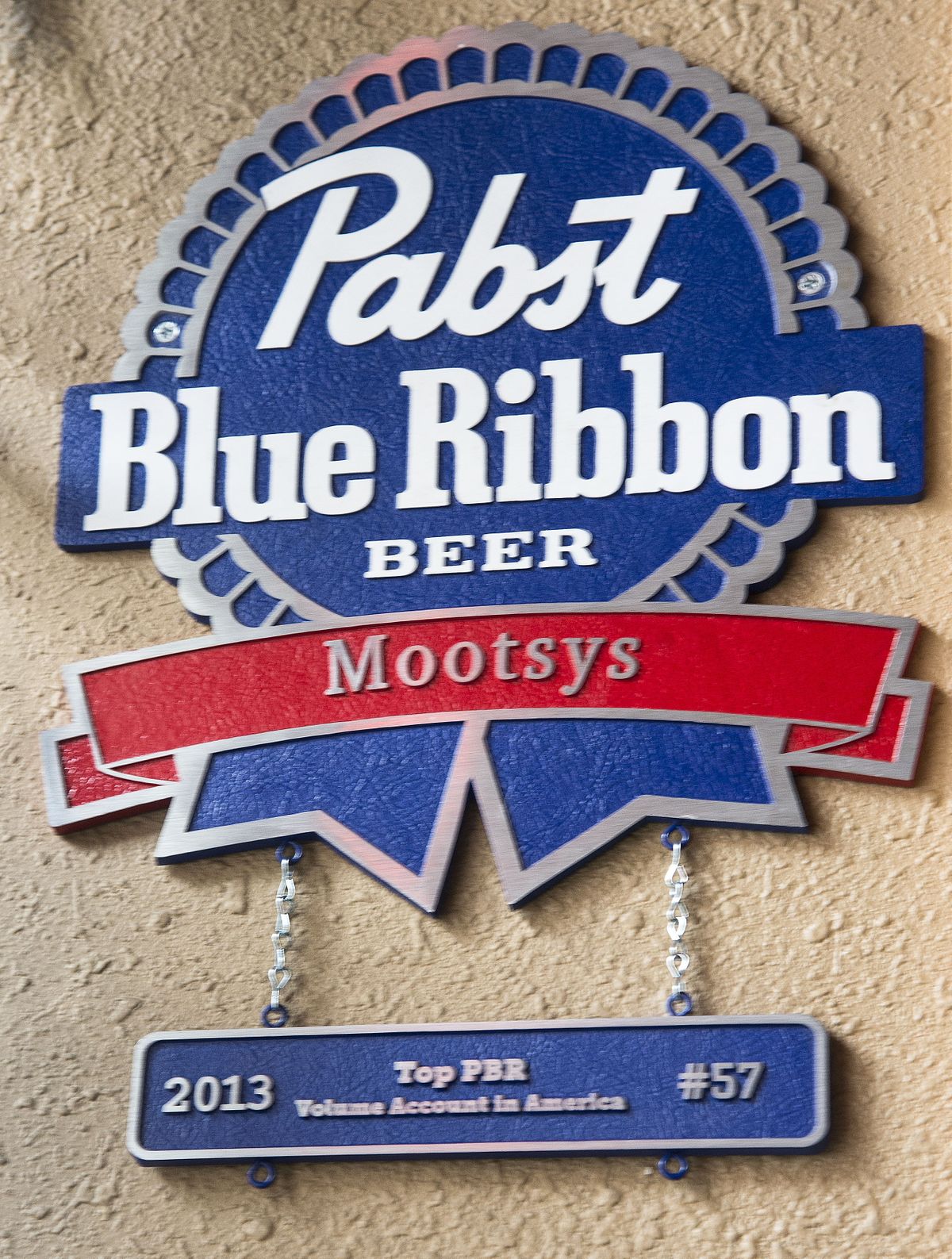 A plaque proclaiming that Mootsy’s in downtown Spokane was the 57th-best last year when it came to selling Pabst Blue Ribbon hangs proudly in the bar. (Colin Mulvany)