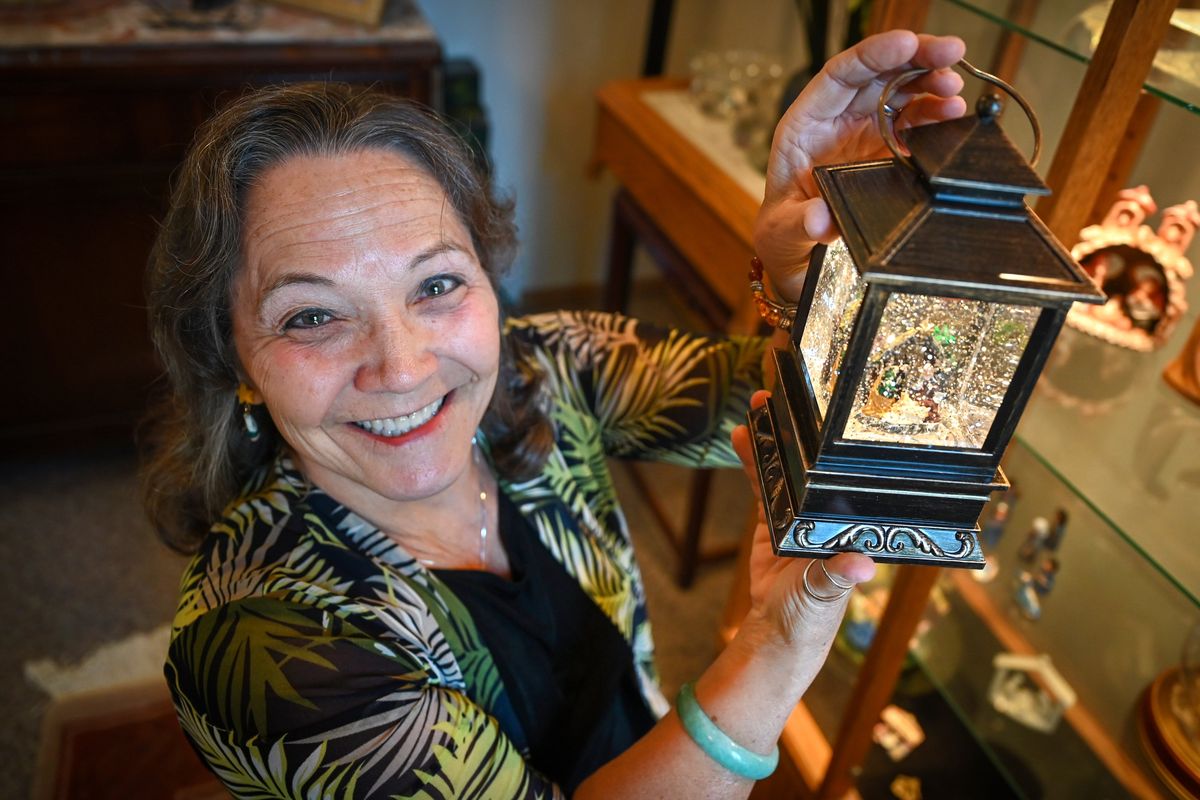 Connie Christilaw has quite an extensive collection of Nativity sets, including this display inside a lantern. Most are quite small and she started collecting when in the Navy, traveling around the world. She has over 60 Nativity sets from all over the world and showing many different cultural representation and styles.  (Dan Pelle/The Spokesman-Review)