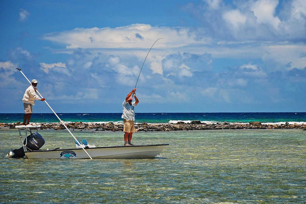 An angler at work at the front of a flats skiff. Bonefish are plentiful and were the initial attraction at Turneffe Flats 30 miles east of Belize City.  (Craig Hayes/Turneffe Flats)