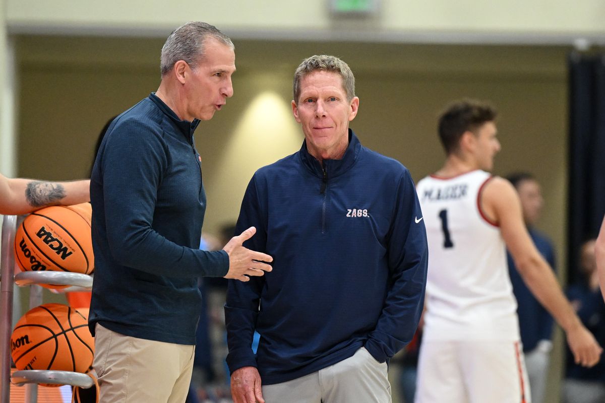Gonzaga Bulldogs head coach Mark Few smiles as he talks to Pepperdine Waves head coach Ed Schilling before the first half of a college basketball game on Monday, Dec. 30, 2024, at Firestone Fieldhouse in Malibu, Calif.  (Tyler Tjomsland/The Spokesman-Review)