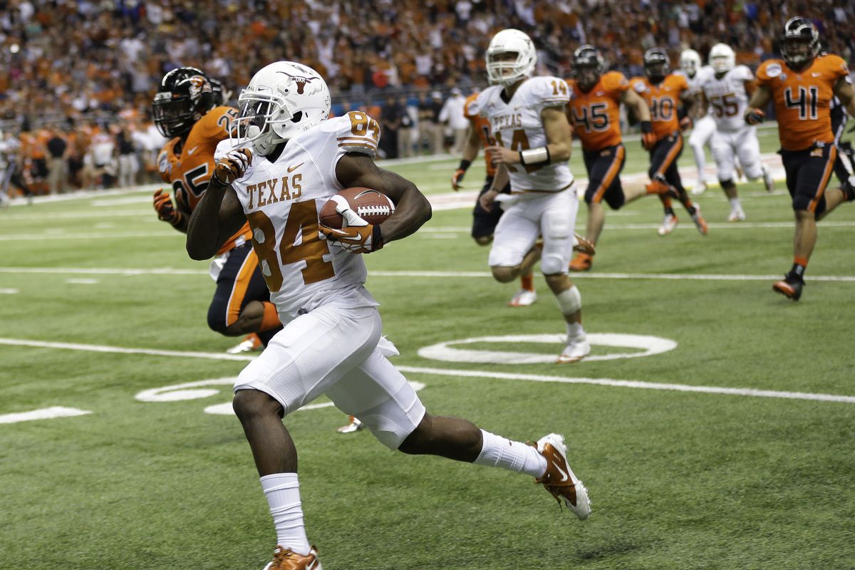 Texas’ Marquise Goodwin runs for a 64-yard touchdown during the second quarter of the Alamo Bowl. Goodwin’s touchdown catch with 2:24 left lifted the Longhorns over the Beavers. (Associated Press)