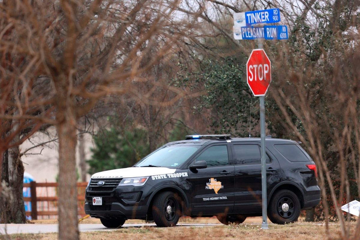 Police secure the area around Congregation Beth Israel synagogue on Saturday, Jan. 15, 2022 in Colleyville, Texas. Authorities say a man has apparently taken hostages at the synagogue near Fort Worth, Texas. The Colleyville Police Department tweeted Saturday afternoon that it was conducting SWAT operations at the address of Congregation Beth Israel.  (Amanda McCoy)
